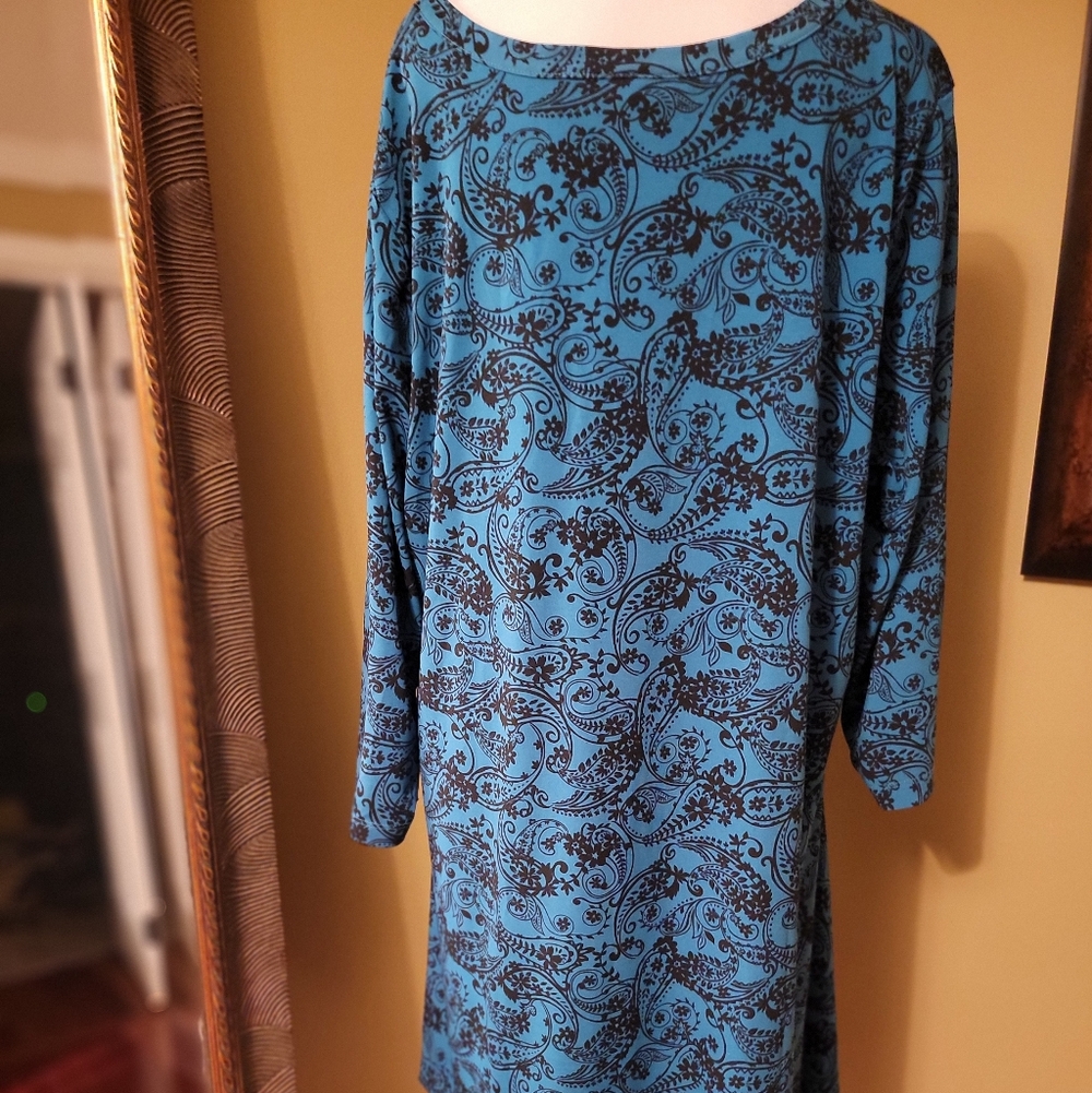 Woman Within Blue Dress with Black Floral Pattern
